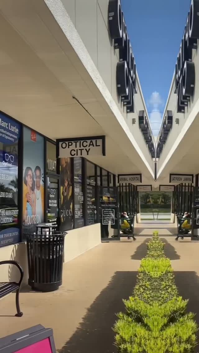 A building with a sign that says optical city