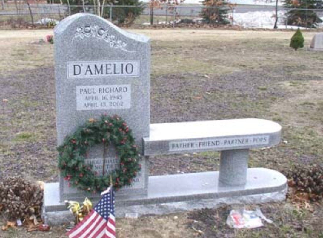 A gravestone with the name d' amelio on it