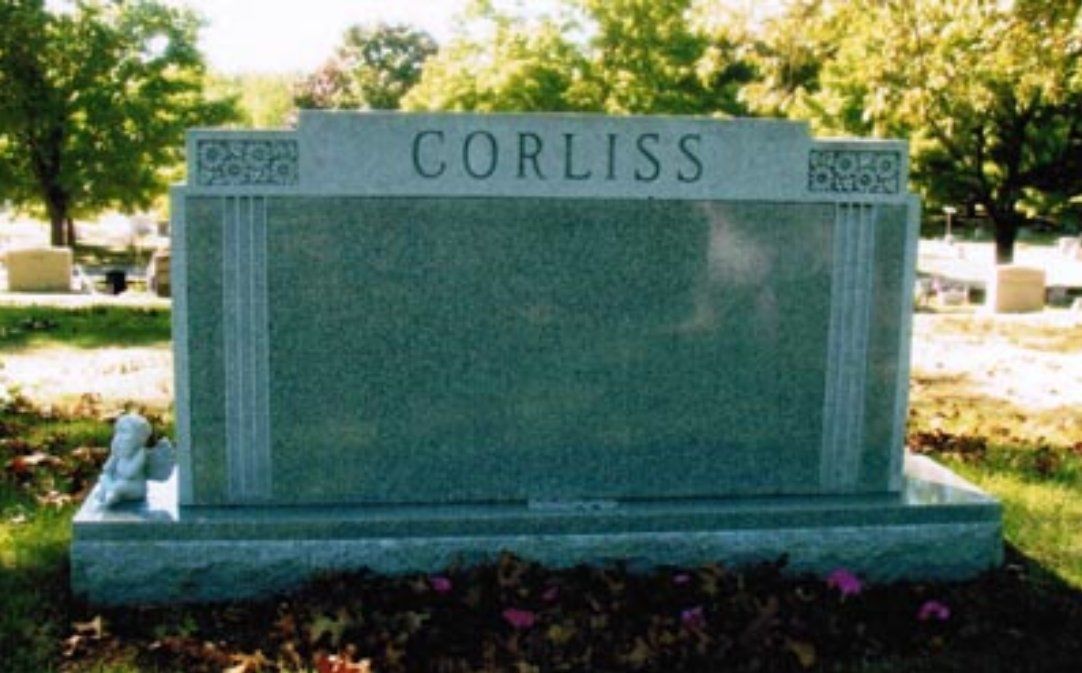 A gravestone in a cemetery with the name corliss on it