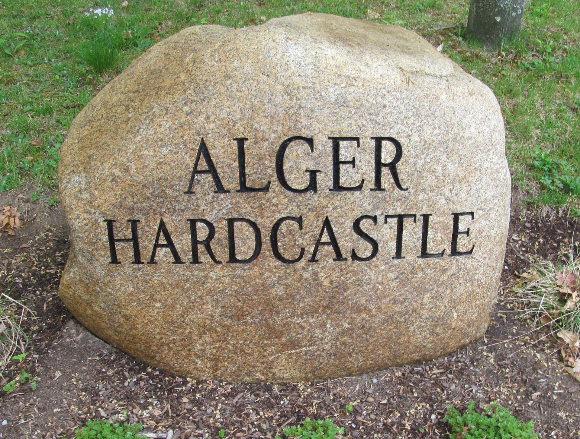 A large rock that says alger hardcastle on it