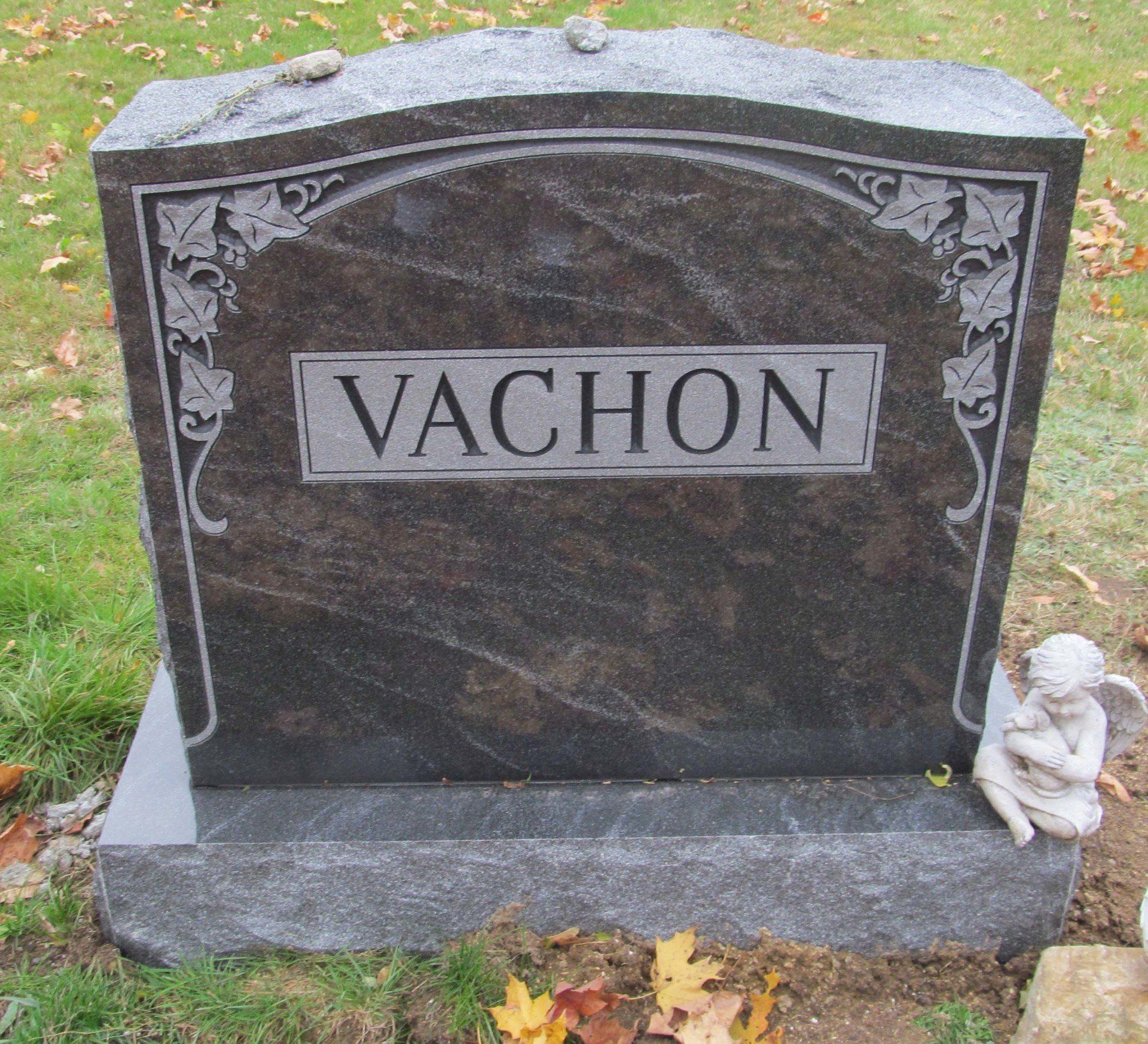 A black gravestone with the name vachon on it