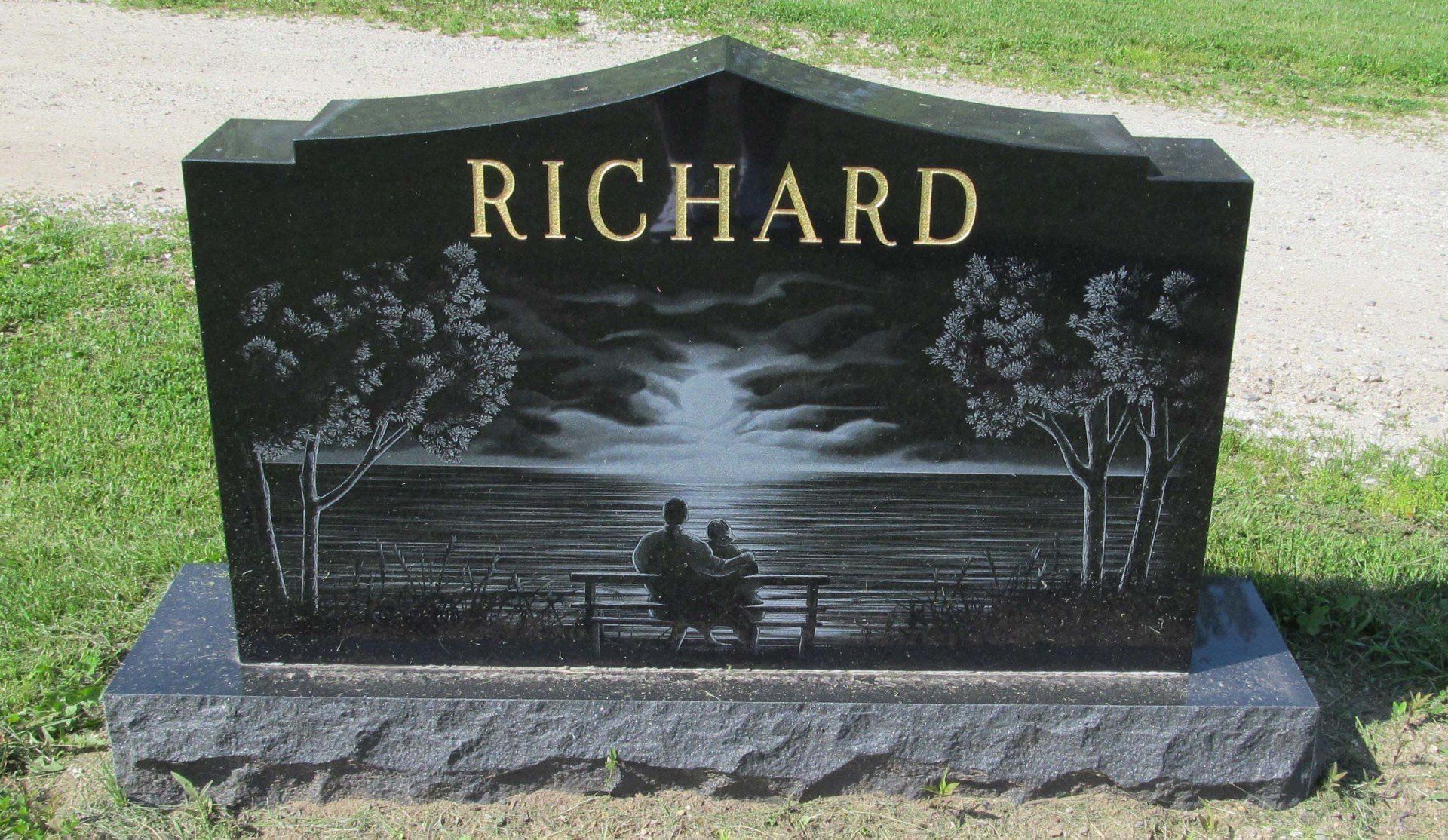 A black gravestone with the name richard on it