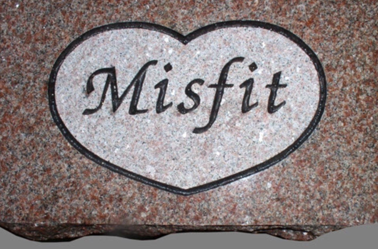 A heart with the word misfit on it