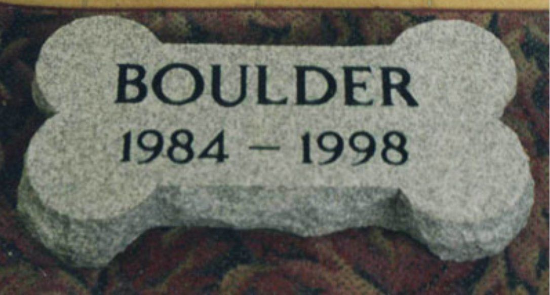 A gravestone for a dog named boulder from 1984 to 1998