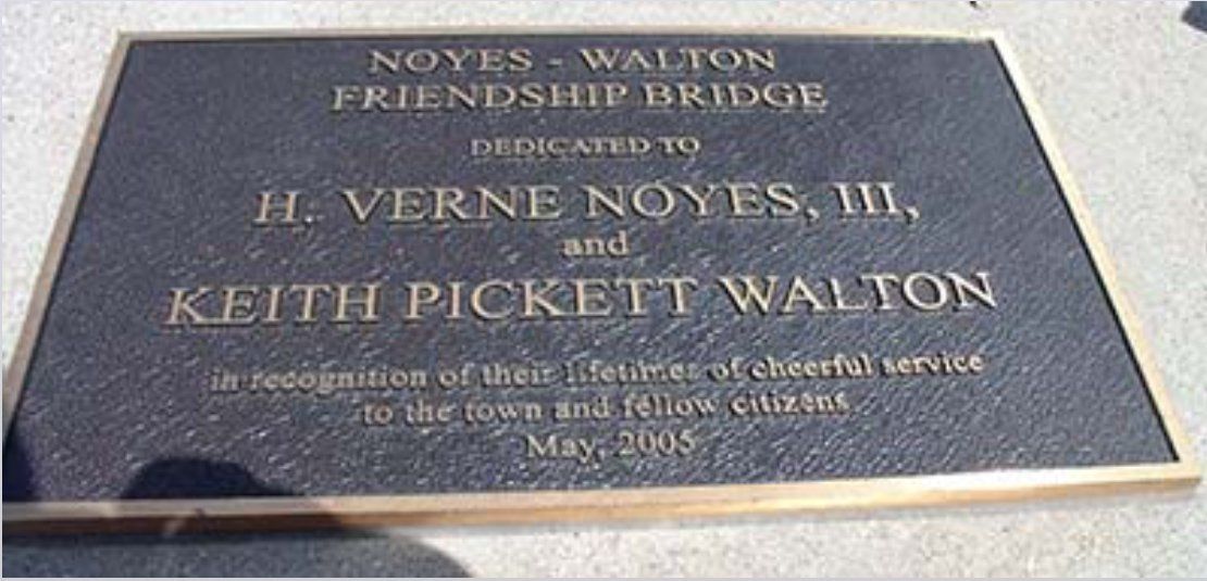 A plaque that says noyes walton friendship bridge dedicated to h. verne noyes iii and keith pickett walton