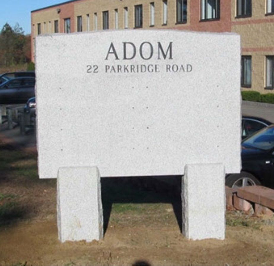 A large stone sign for adom 22 parkridge road