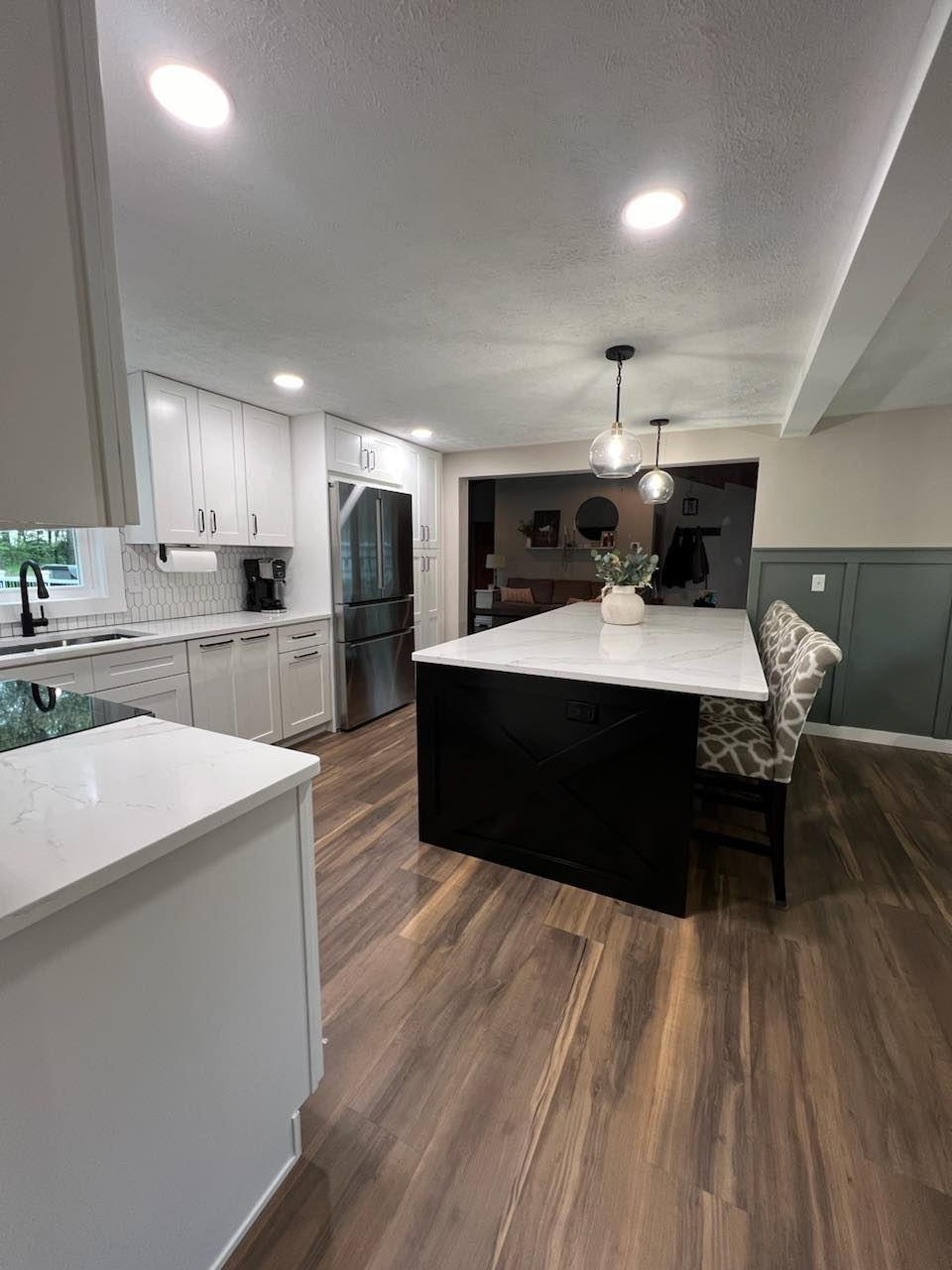 There is a large island in the middle of the kitchen.