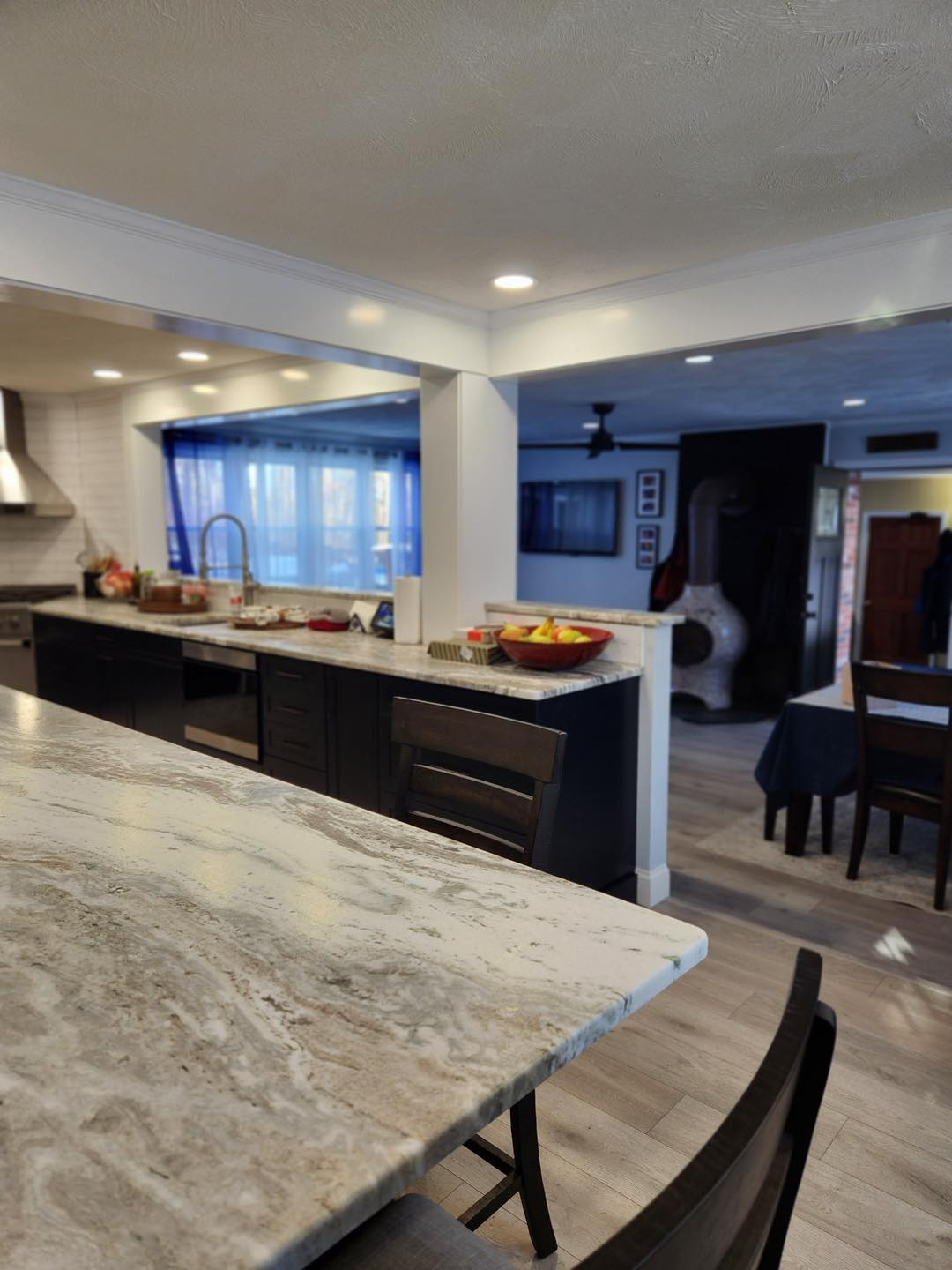 A kitchen with a table and chairs and a sink