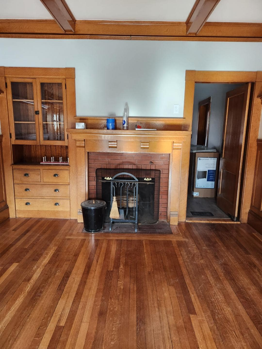 There is a fireplace in the middle of the room.