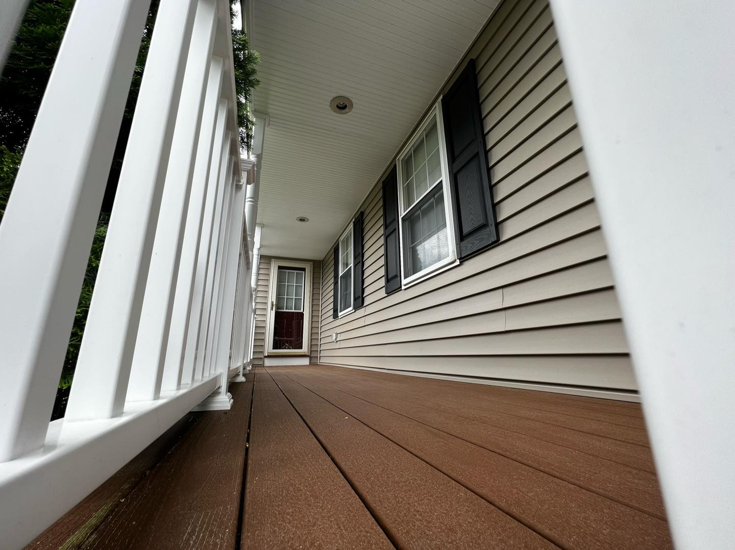 A house with a porch and a white railing