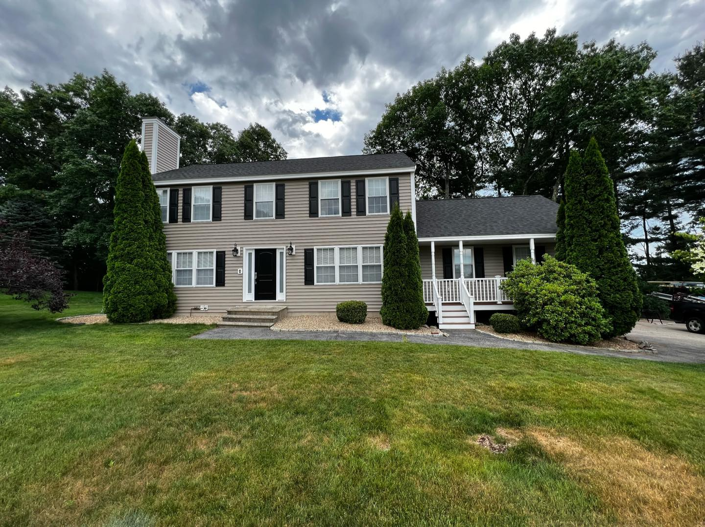 A large house with a large lawn in front of it