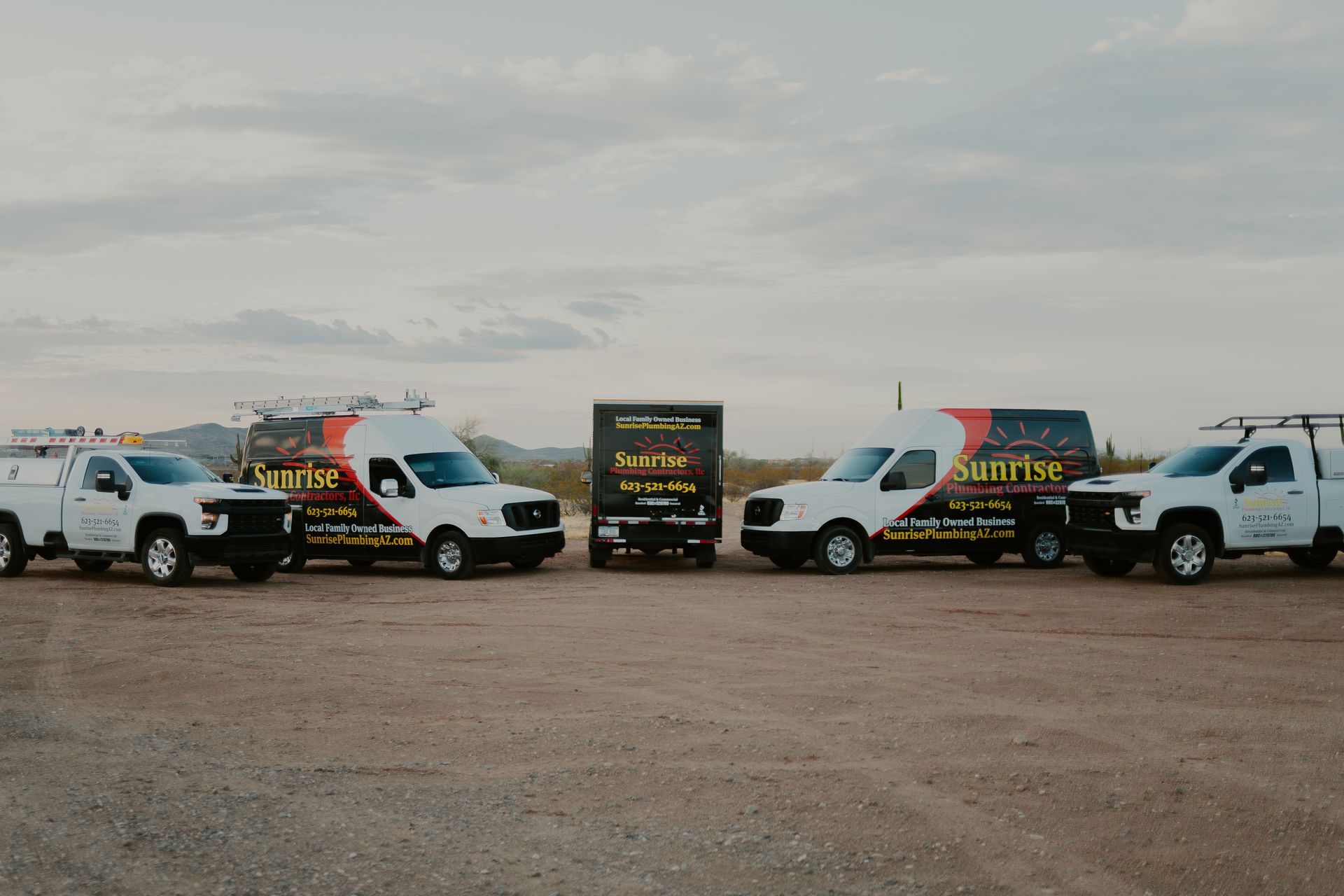 Five work trucks with 