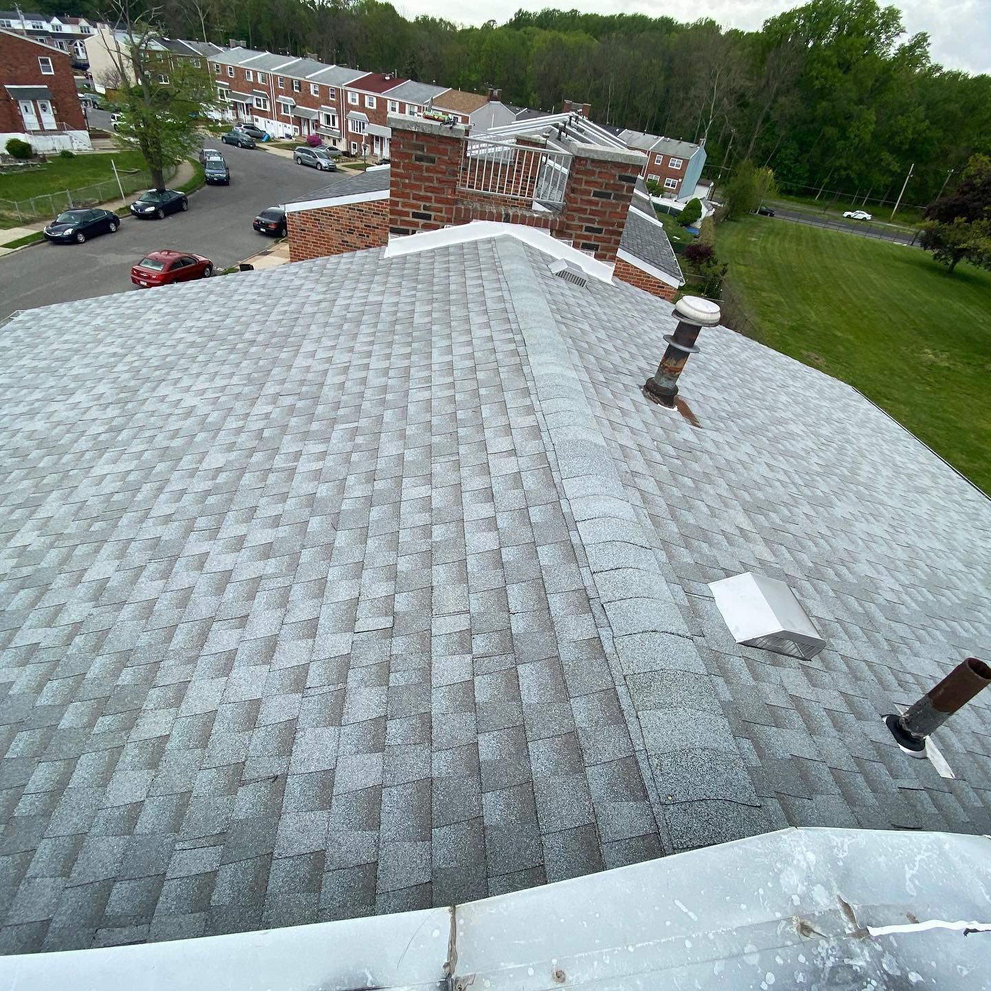 An aerial view of a roof with a chimney on it.