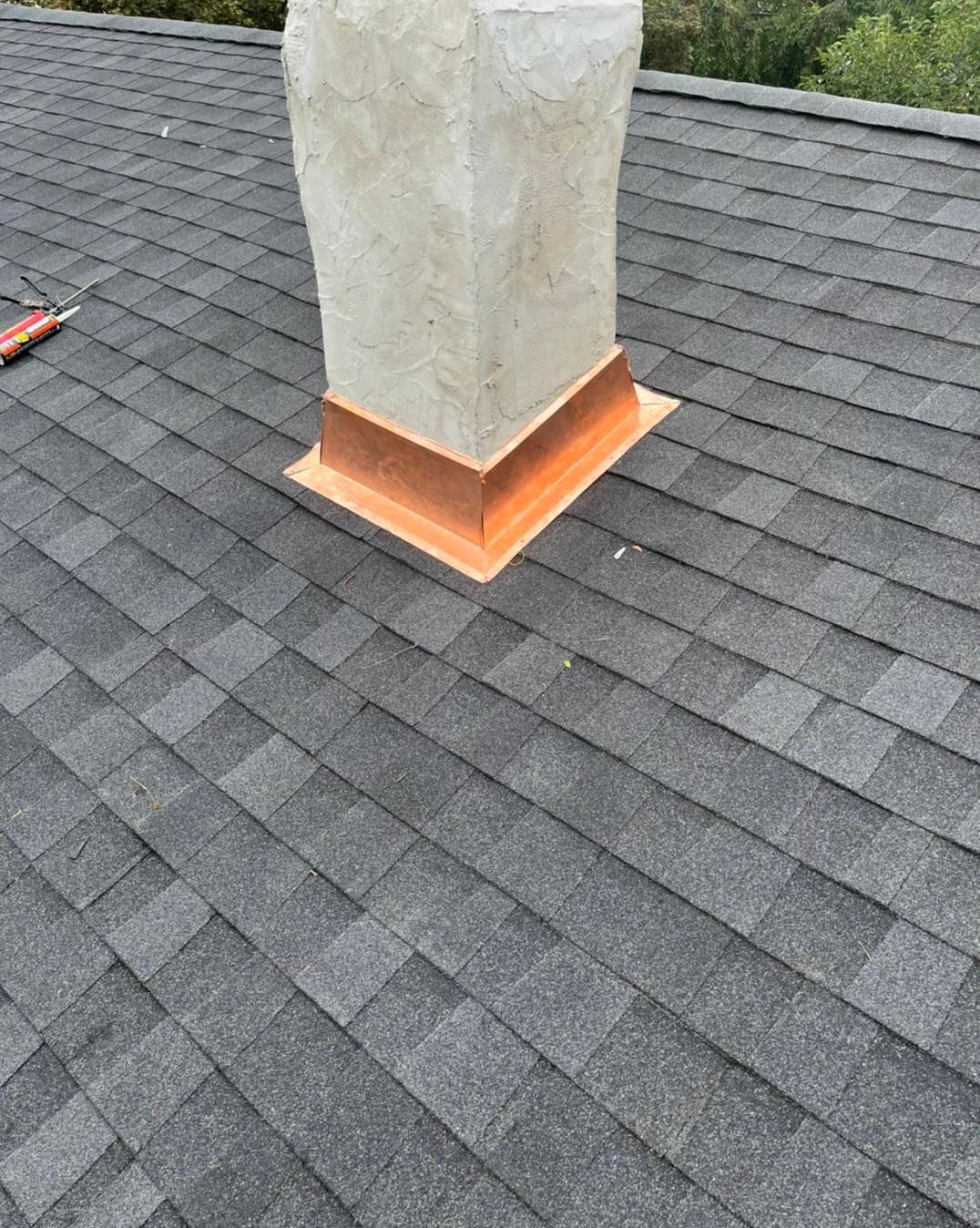A chimney is sitting on top of a roof.