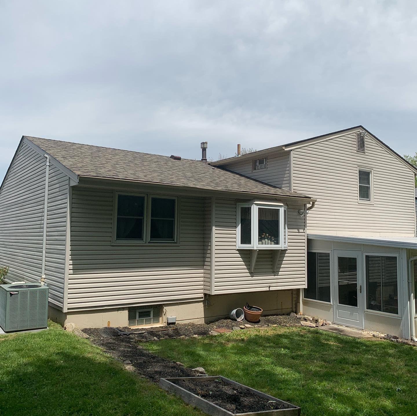 A house with a large window on the side of it
