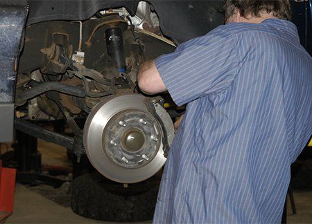 Mechanic changing the brake disc