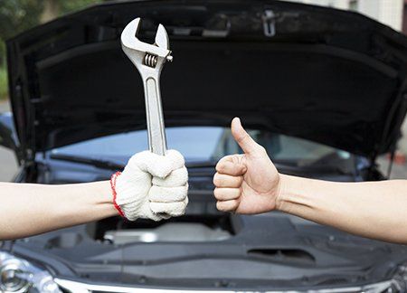 Hand of professional Auto mechanic with wrench