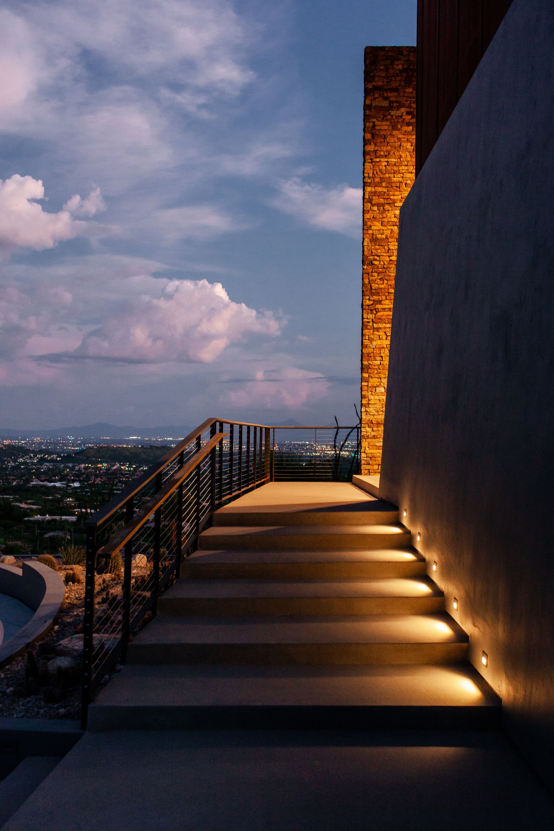 A set of stairs leading up to a building at night