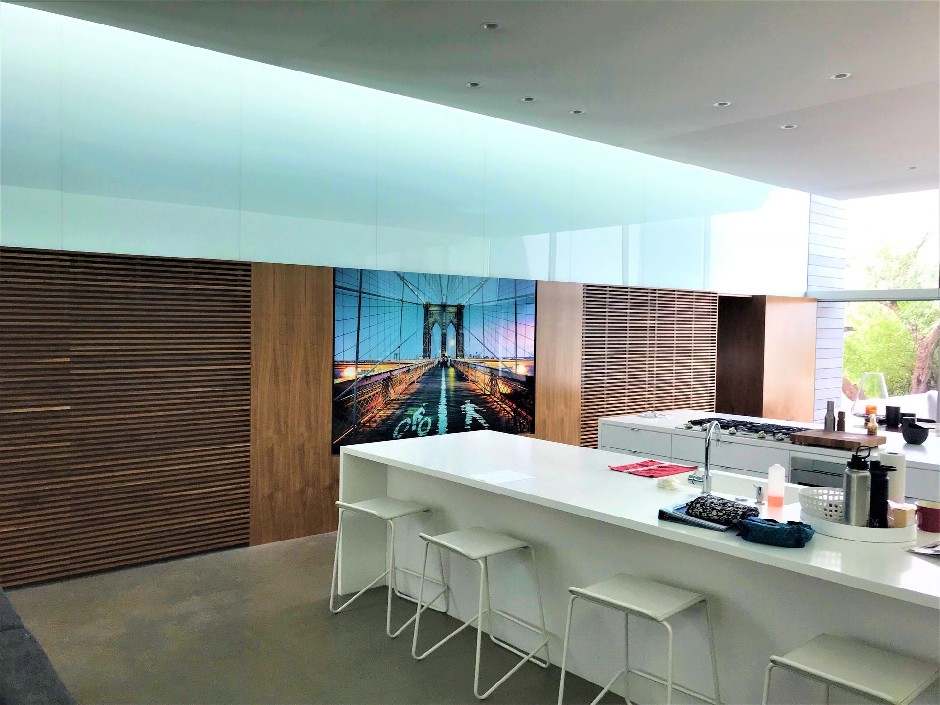 A kitchen with a large island and stools