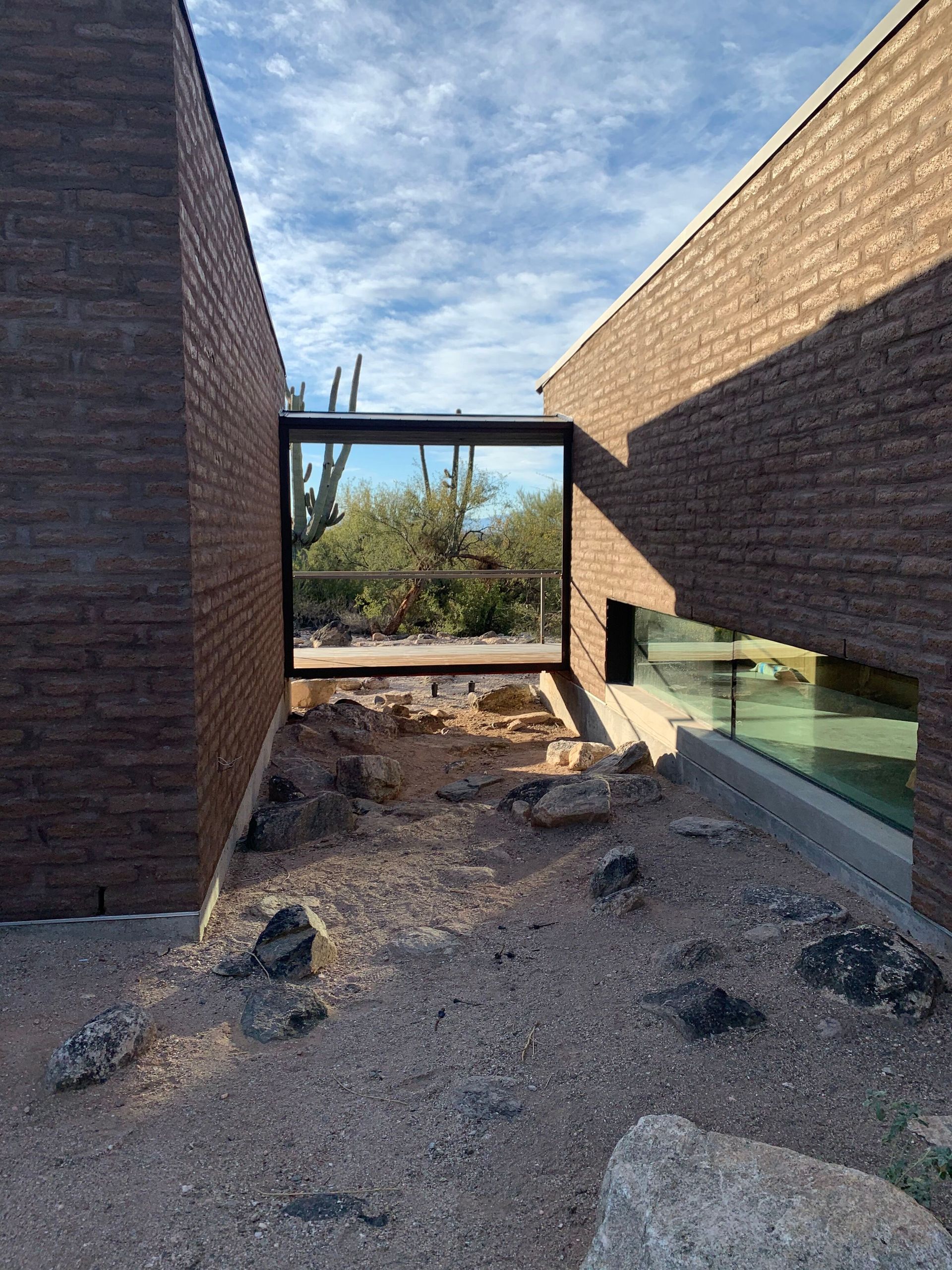 A brick building with a large window in the middle of it.