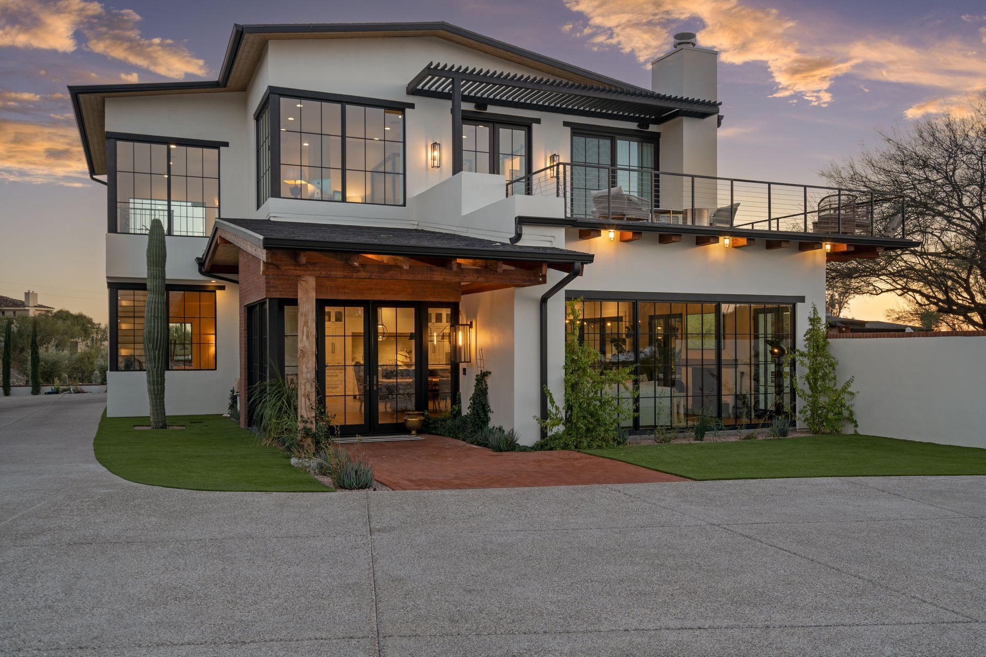 A large white house with a lot of windows is for sale.