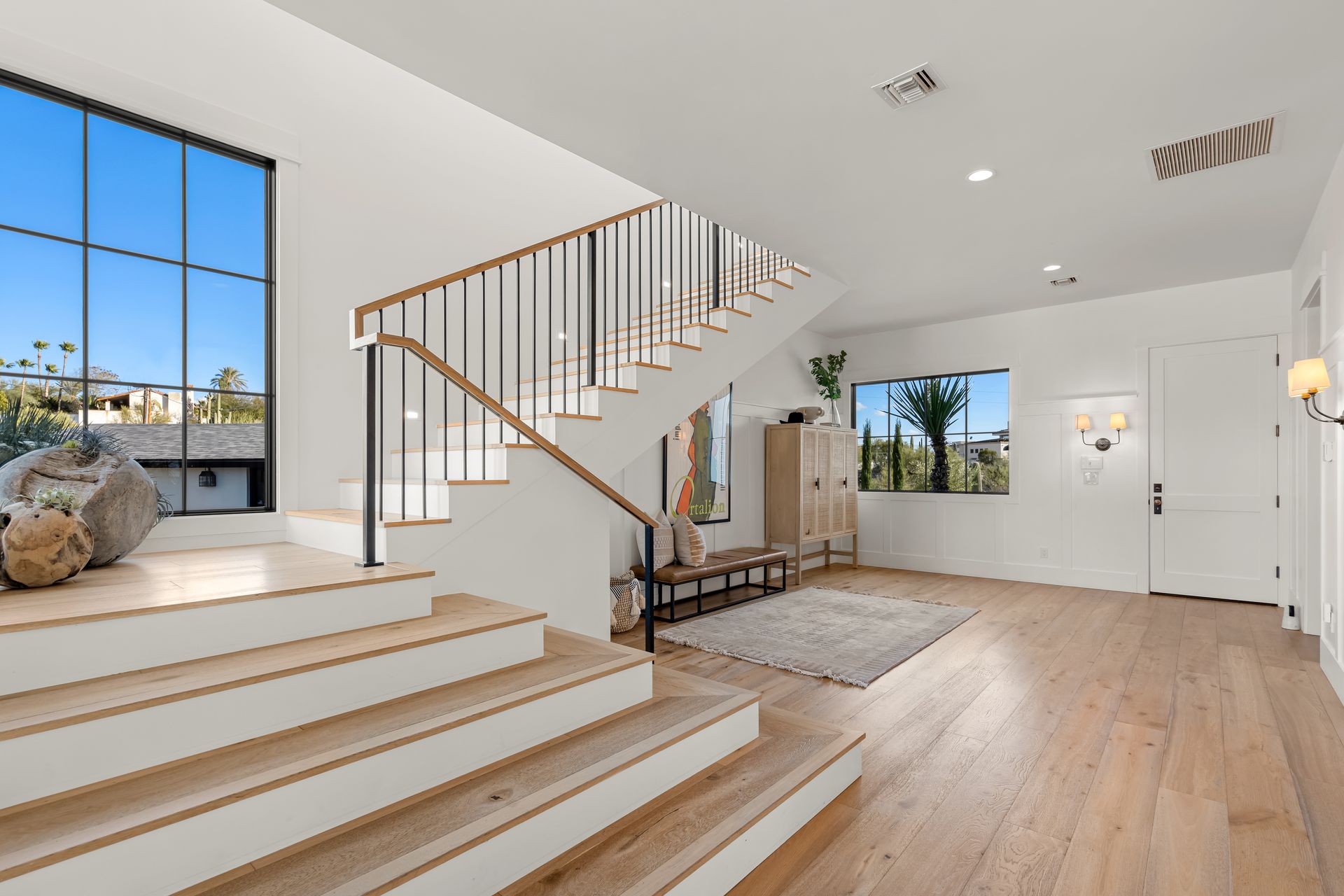 There is a staircase leading up to the second floor of a house.