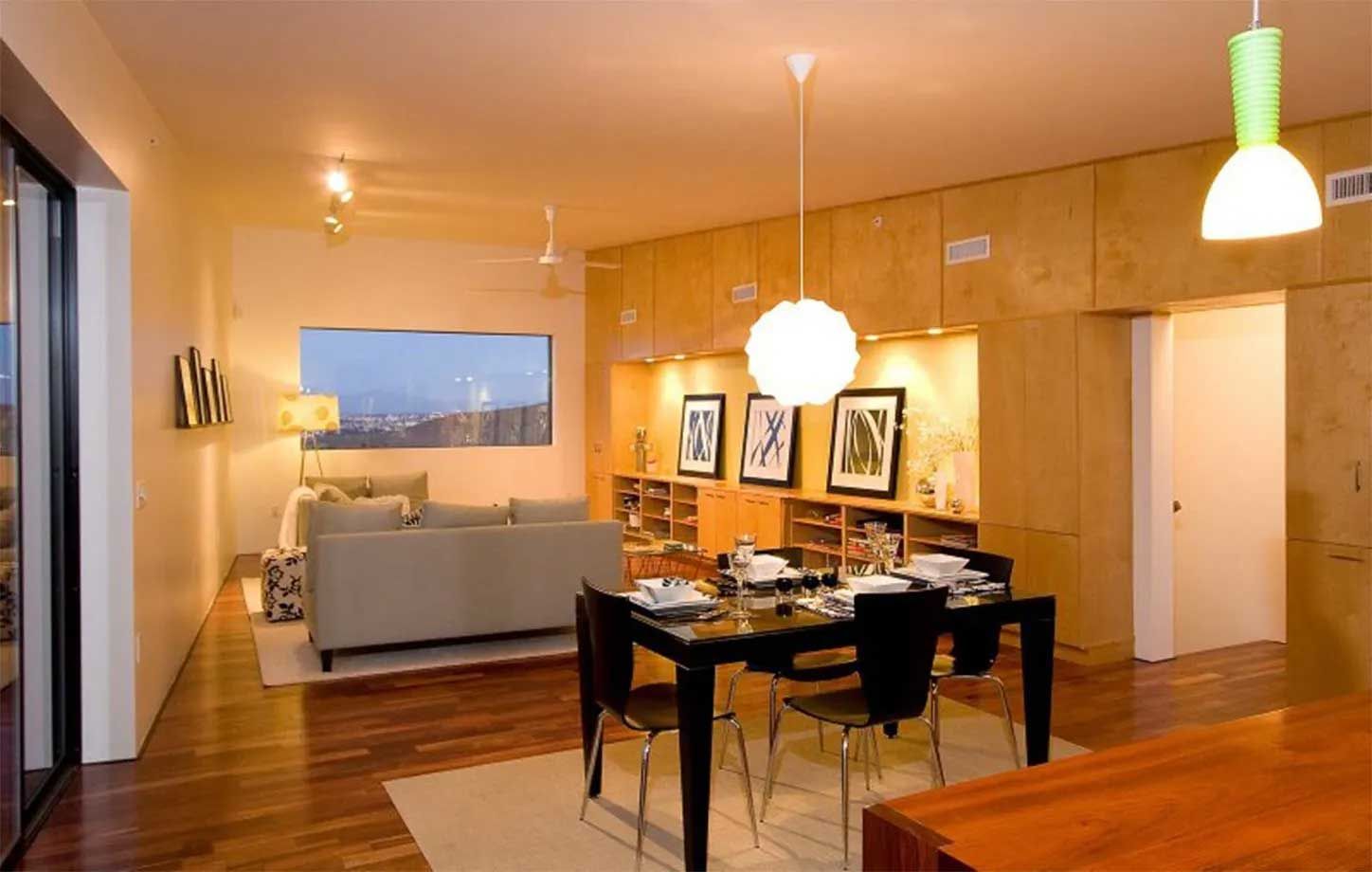 A living room with a dining table and chairs and a couch