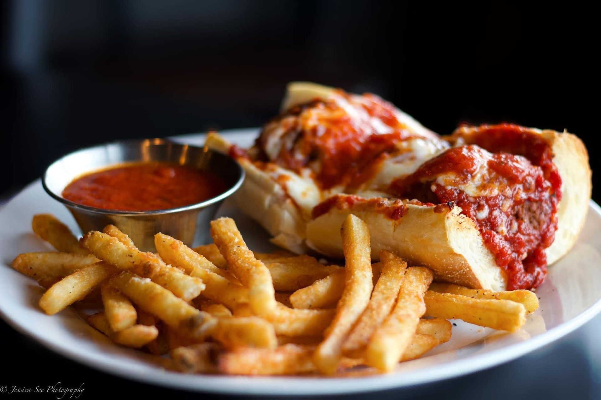Meatball sandwich with fries