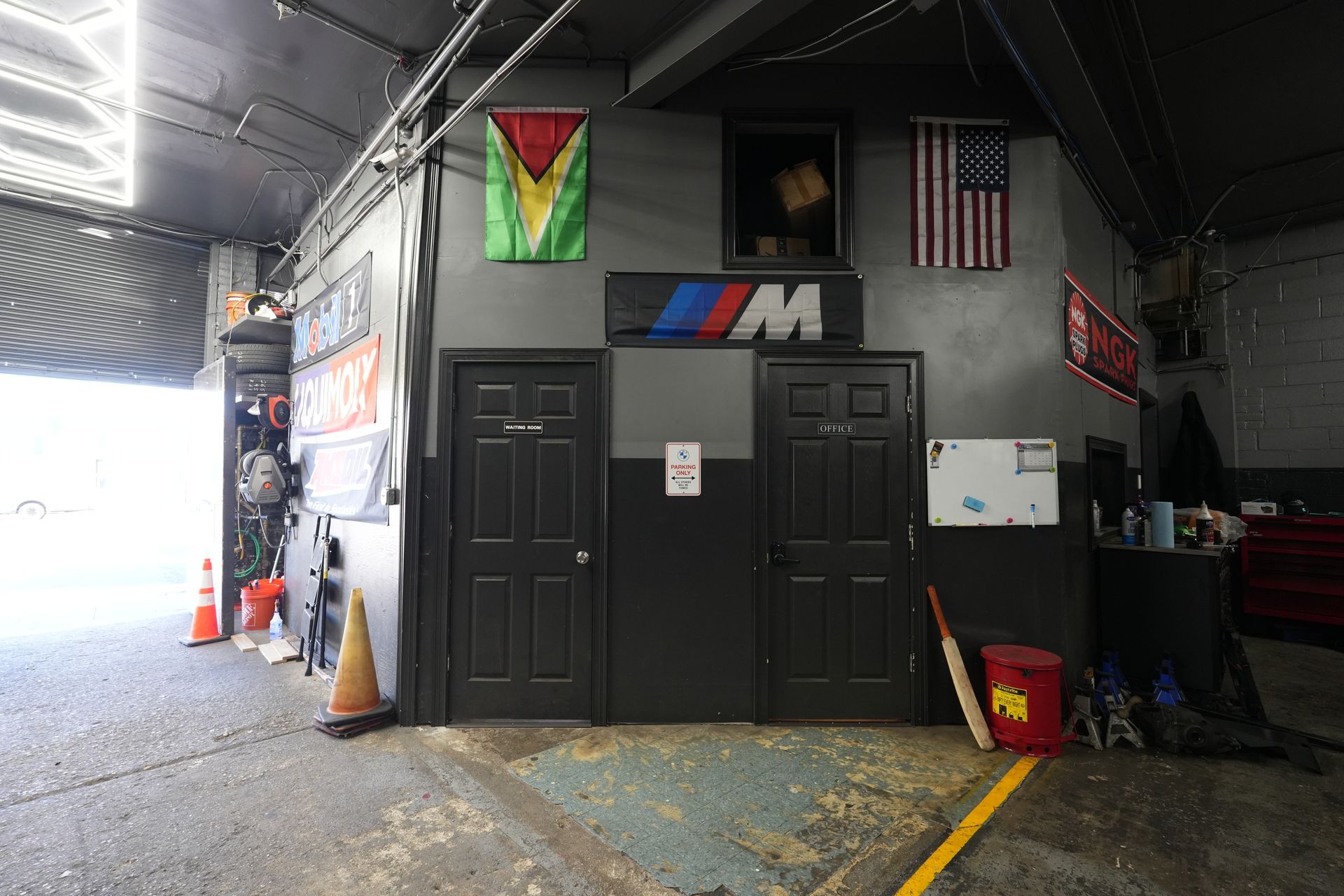 A garage with a bmw logo on the wall