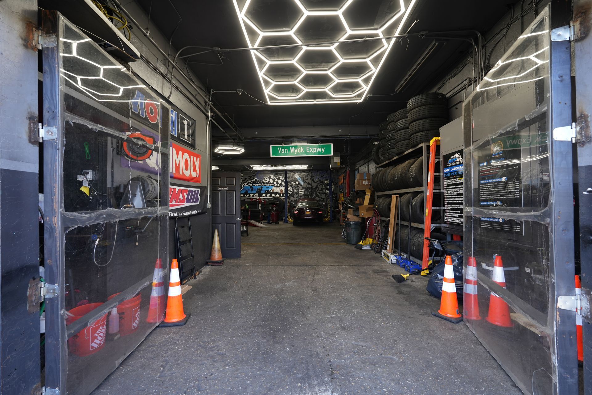 A garage filled with lots of tires and cones.
