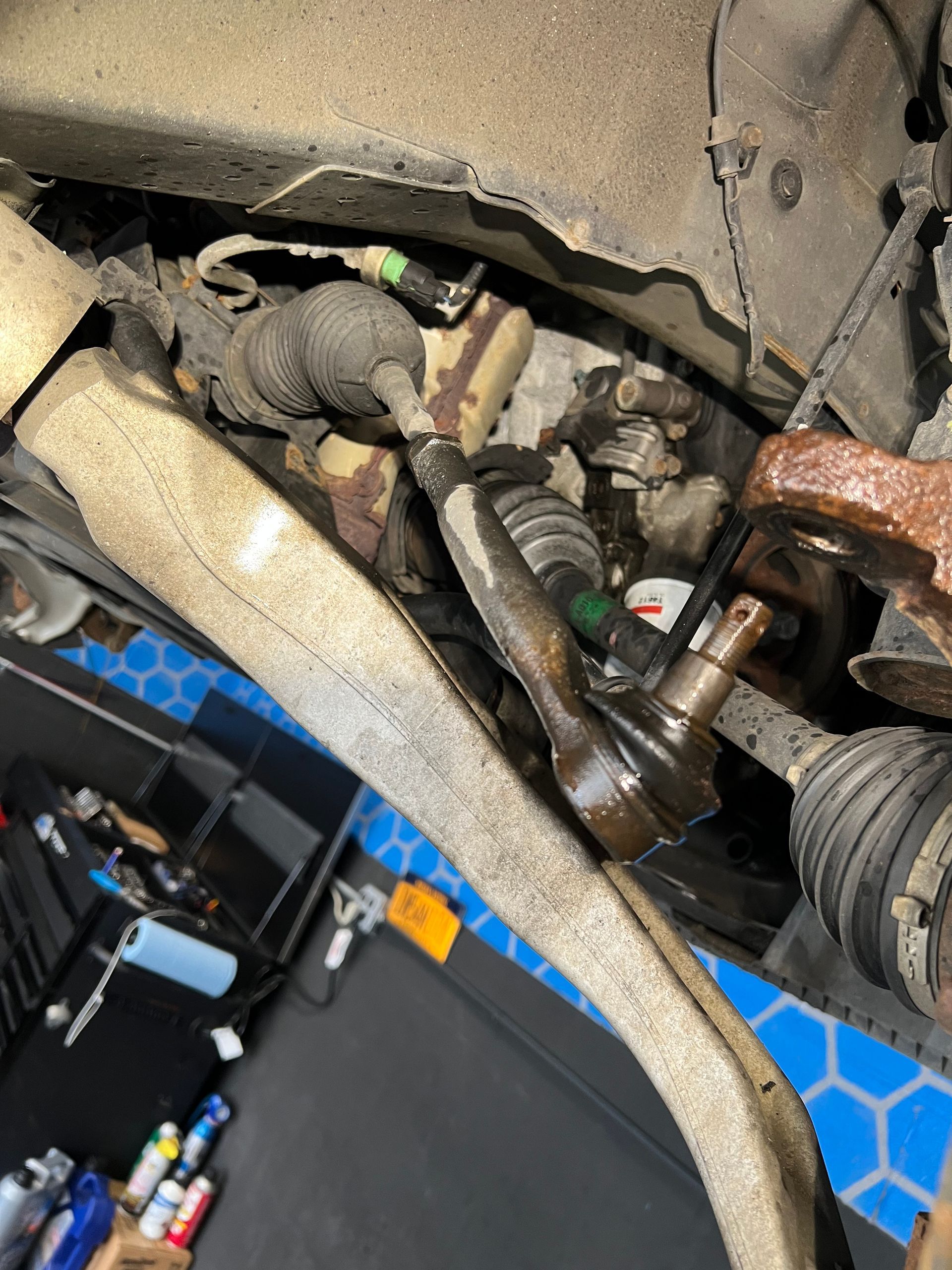 A close up of a steering arm on a car