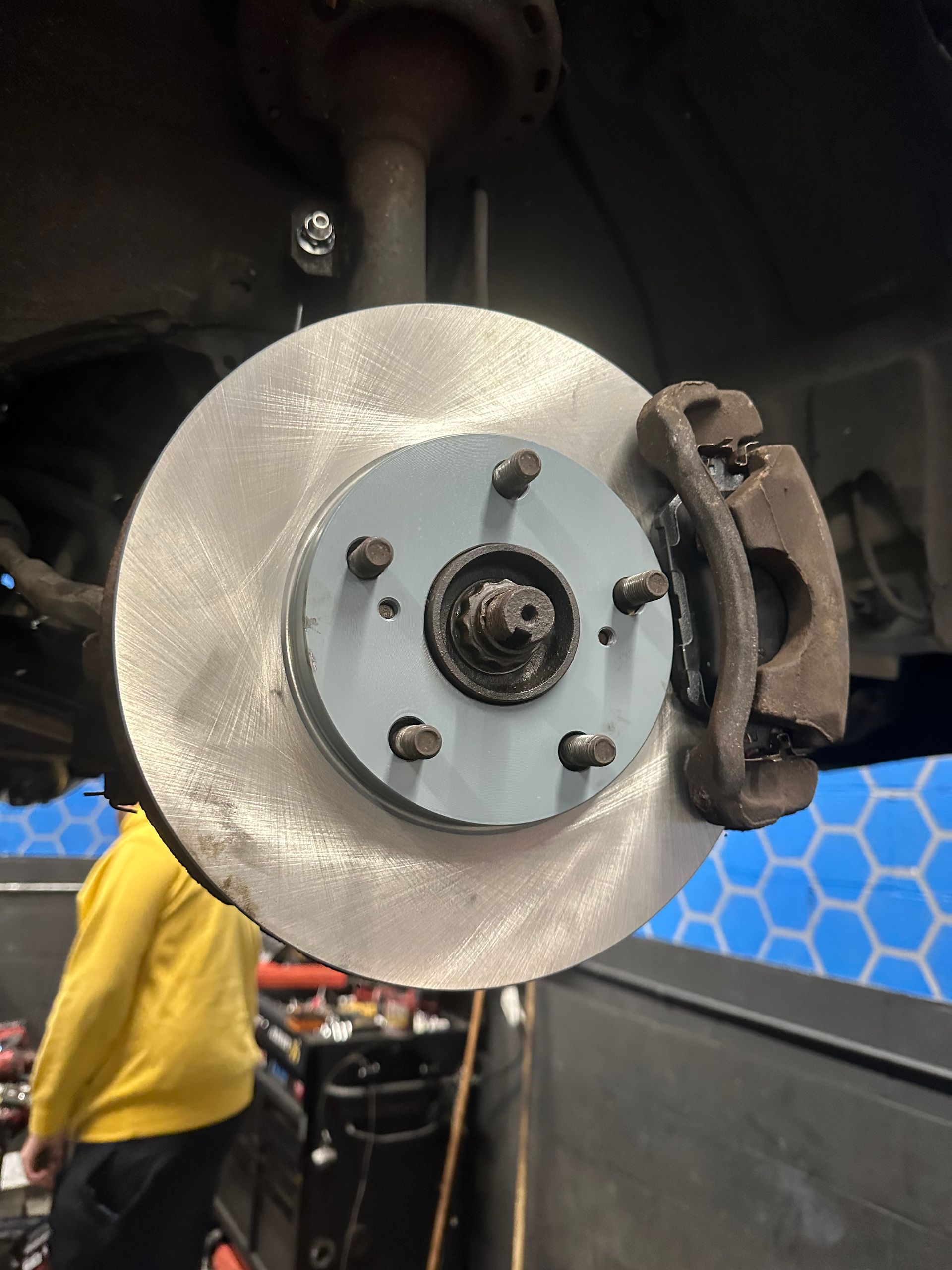 A close up of a brake disc on a car