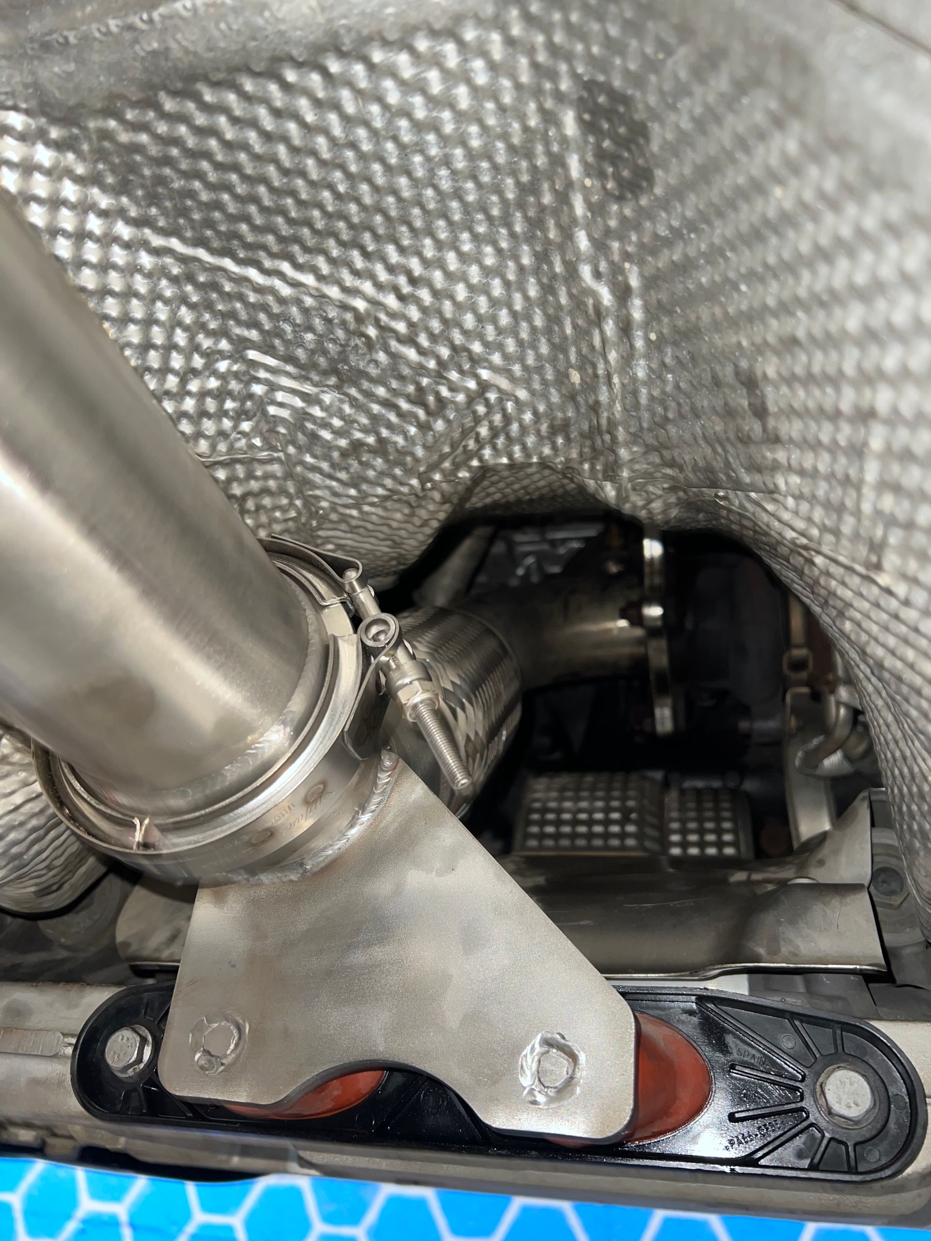 A close up of a exhaust pipe on a car.