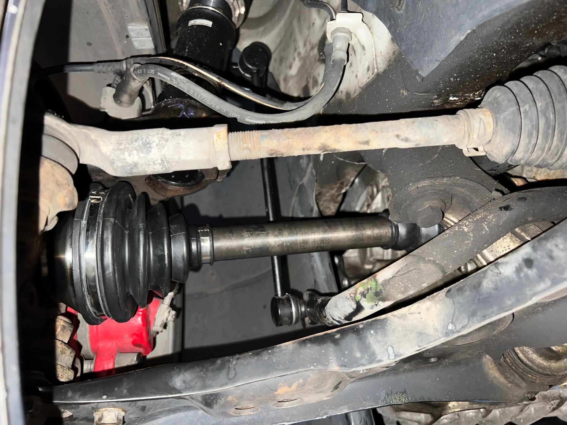 A close up of a drive shaft in a car