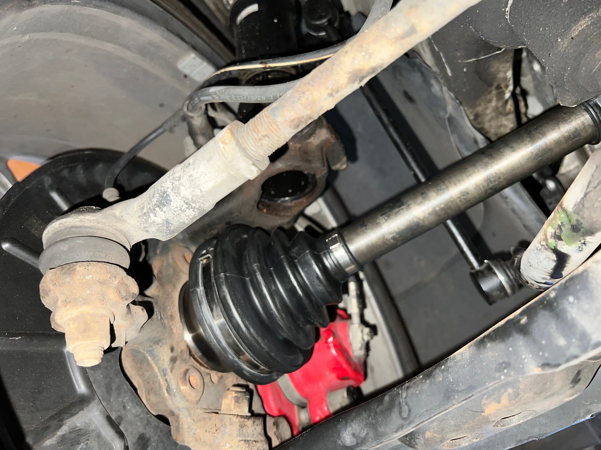 A close up of a drive shaft on a car