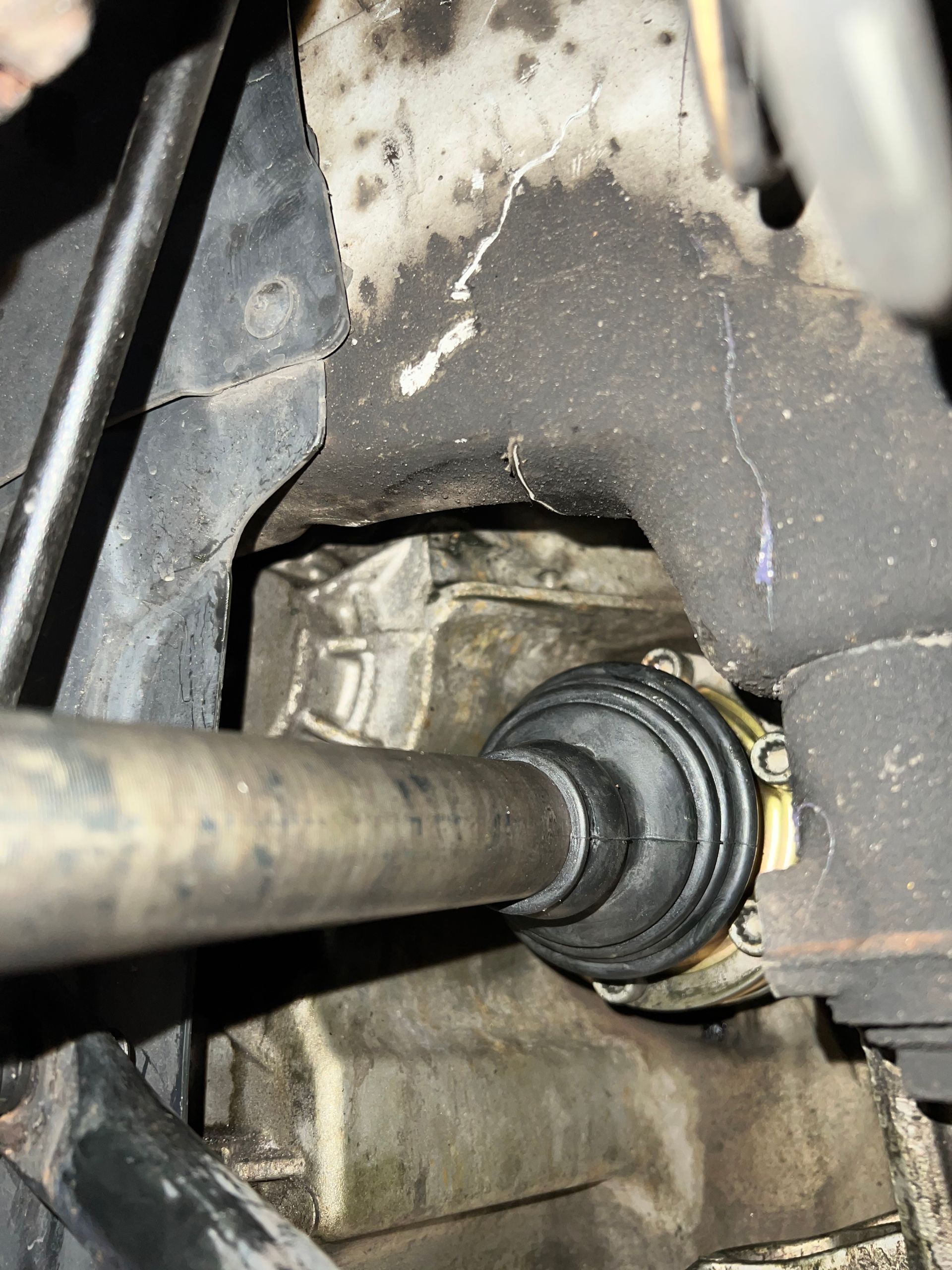 A close up of a driveshaft in a car