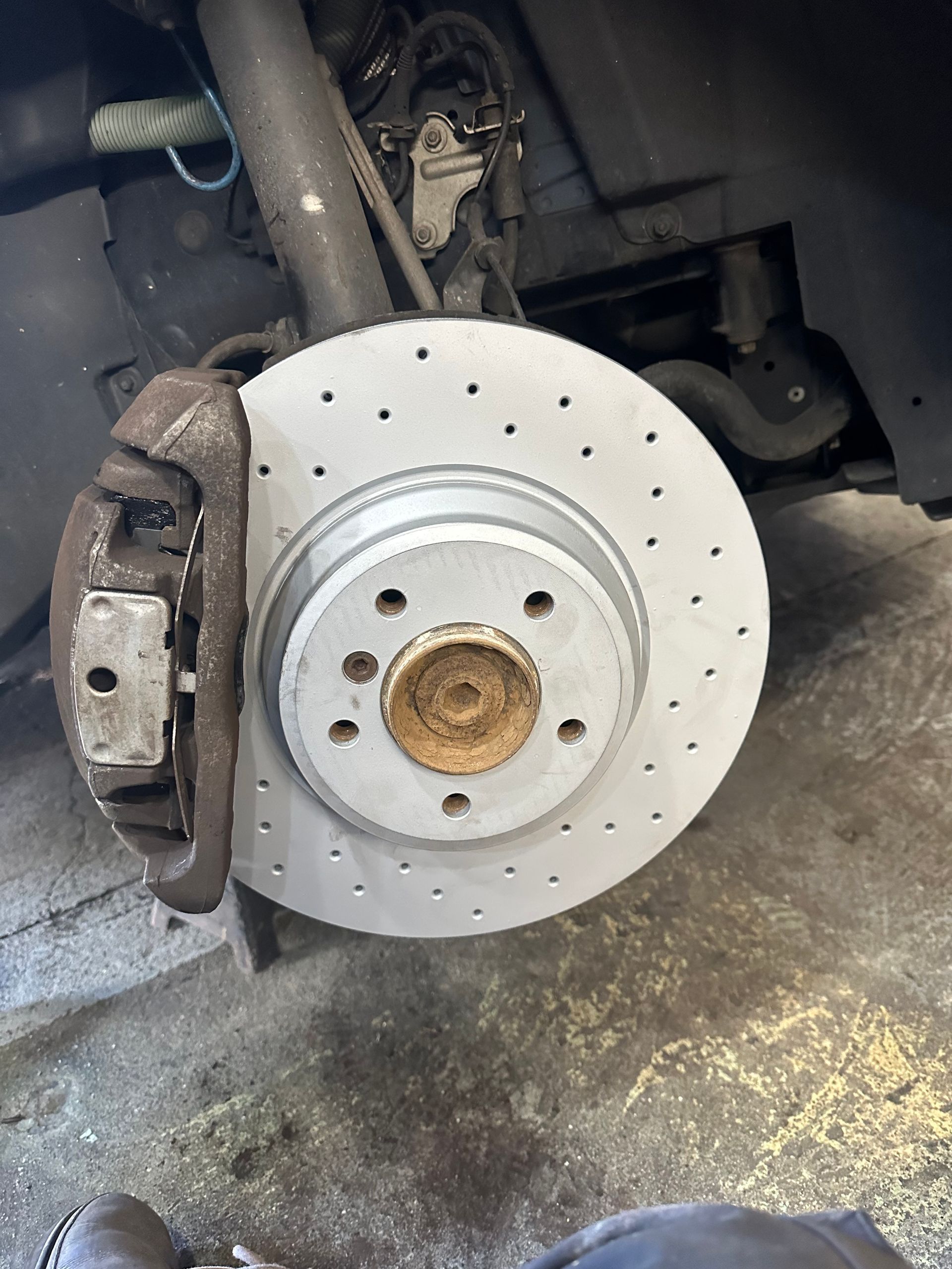 A close up of a brake disc on a car