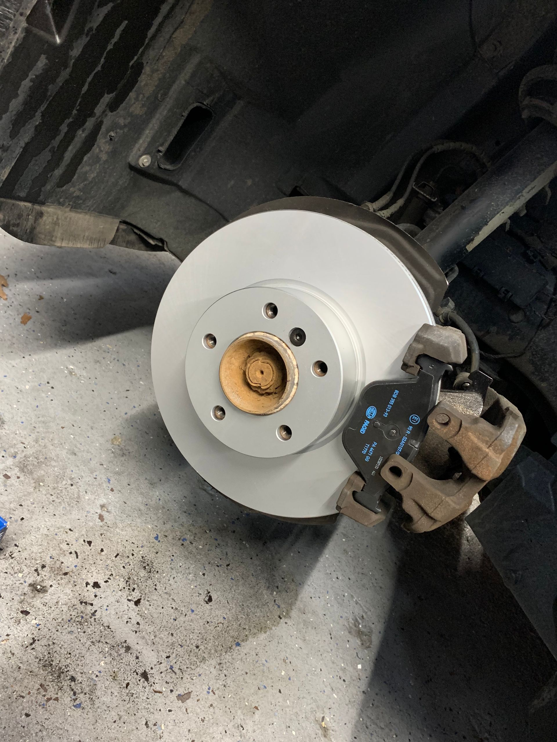 A close up of a brake disc on a car