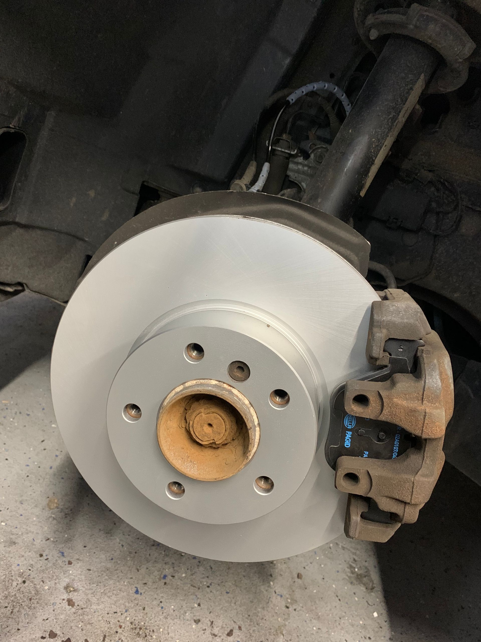 A close up of a brake disc on a car