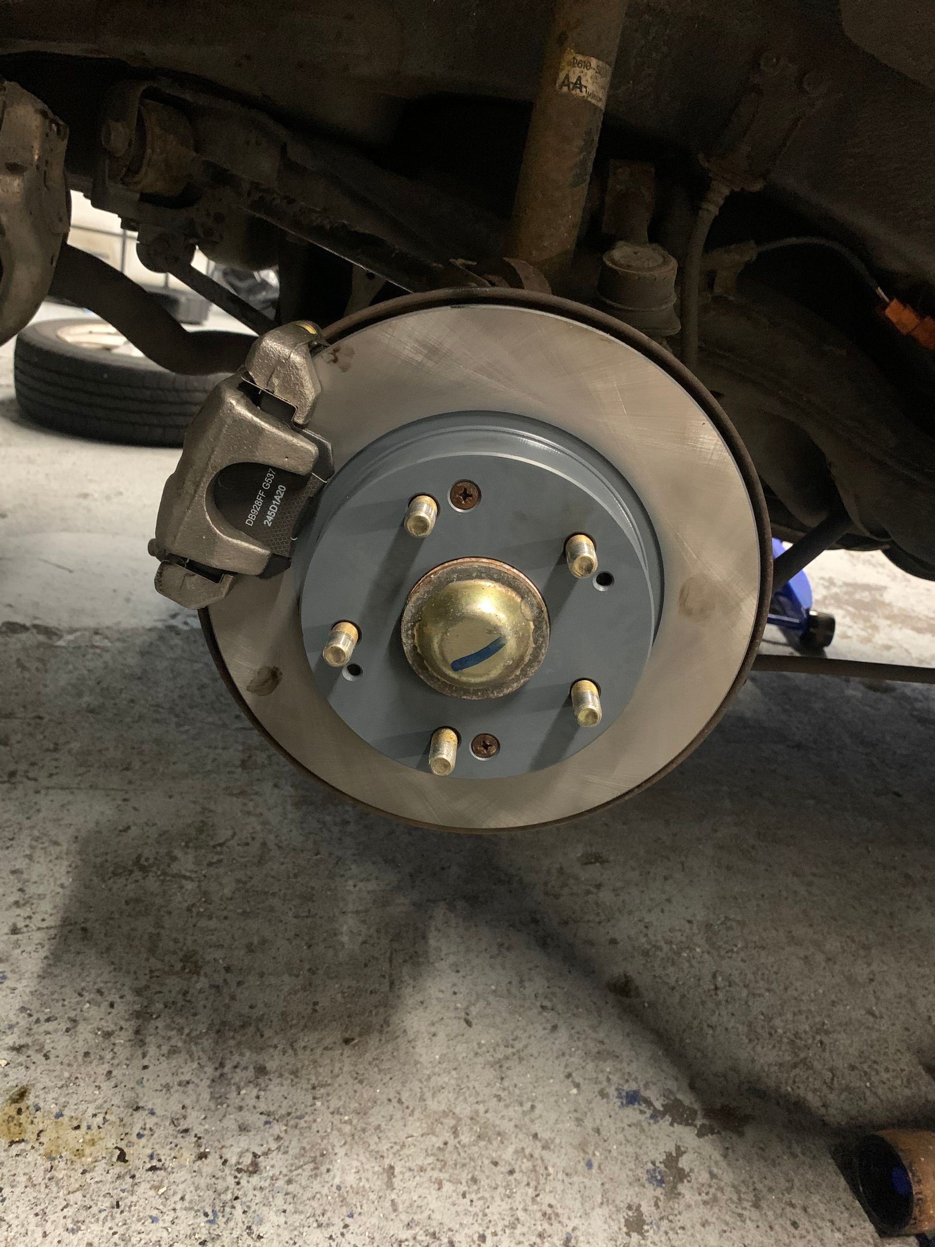 A close up of a brake disc on a car.