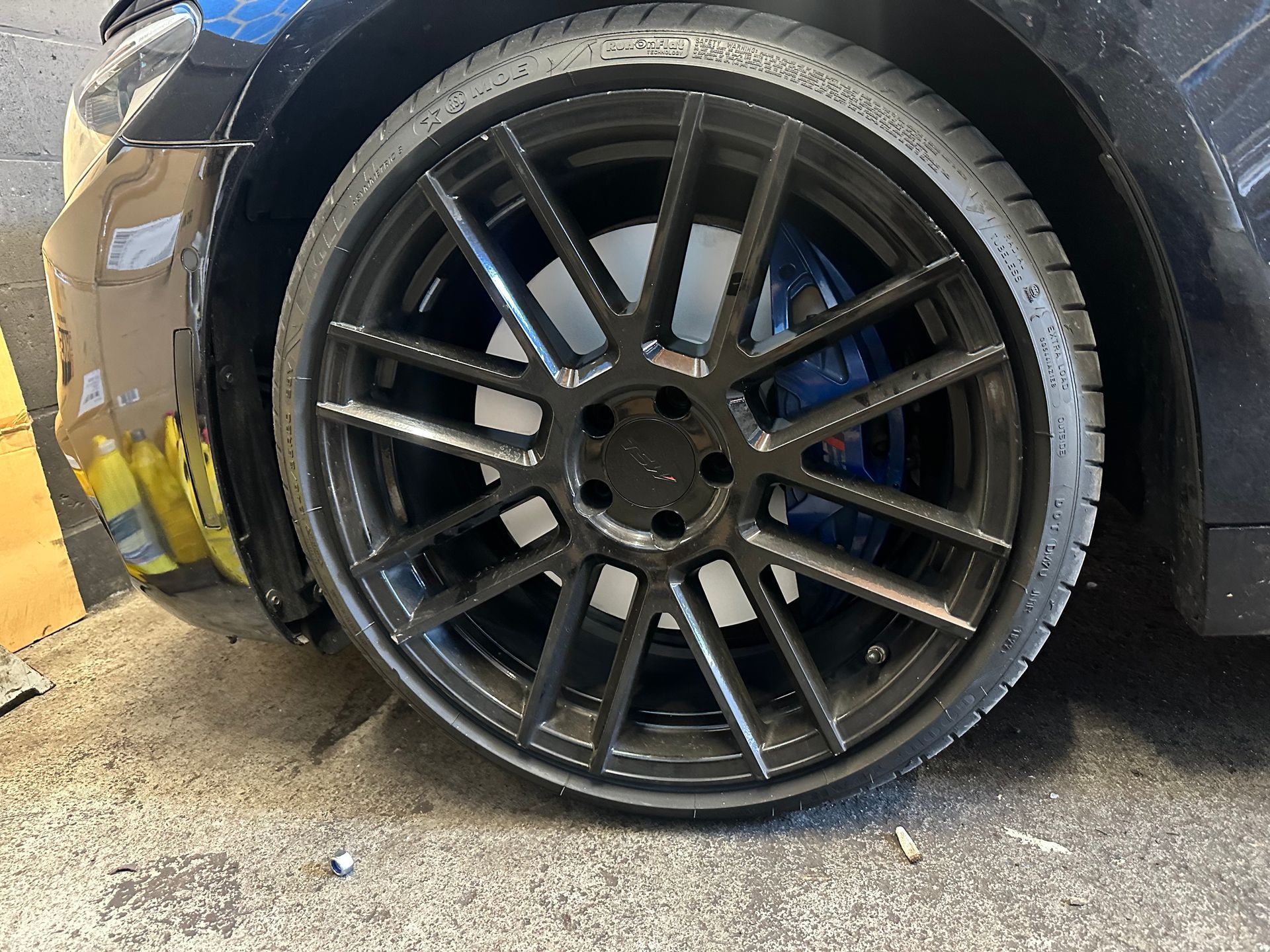 A close up of a car wheel with a tire on it.