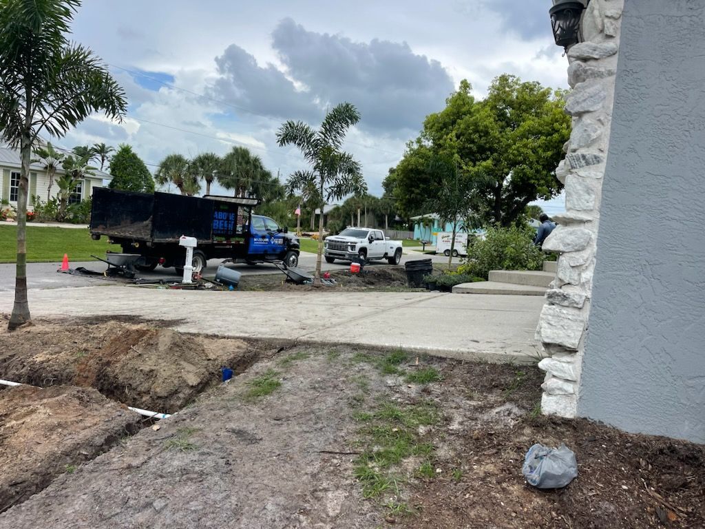 A dump truck is parked in front of a house.