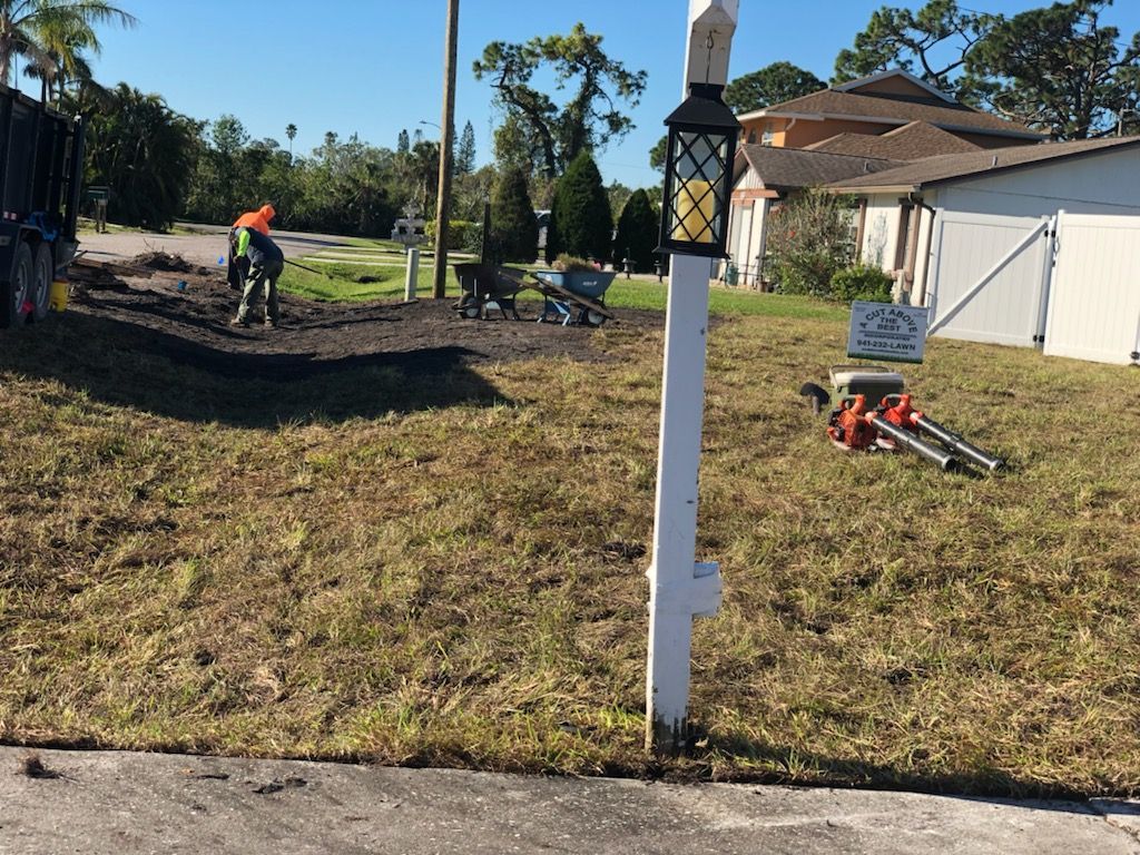 A white pole with a lantern on top of it