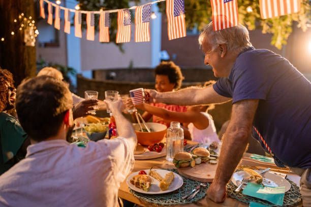 People enjoying a meal at a backyard party