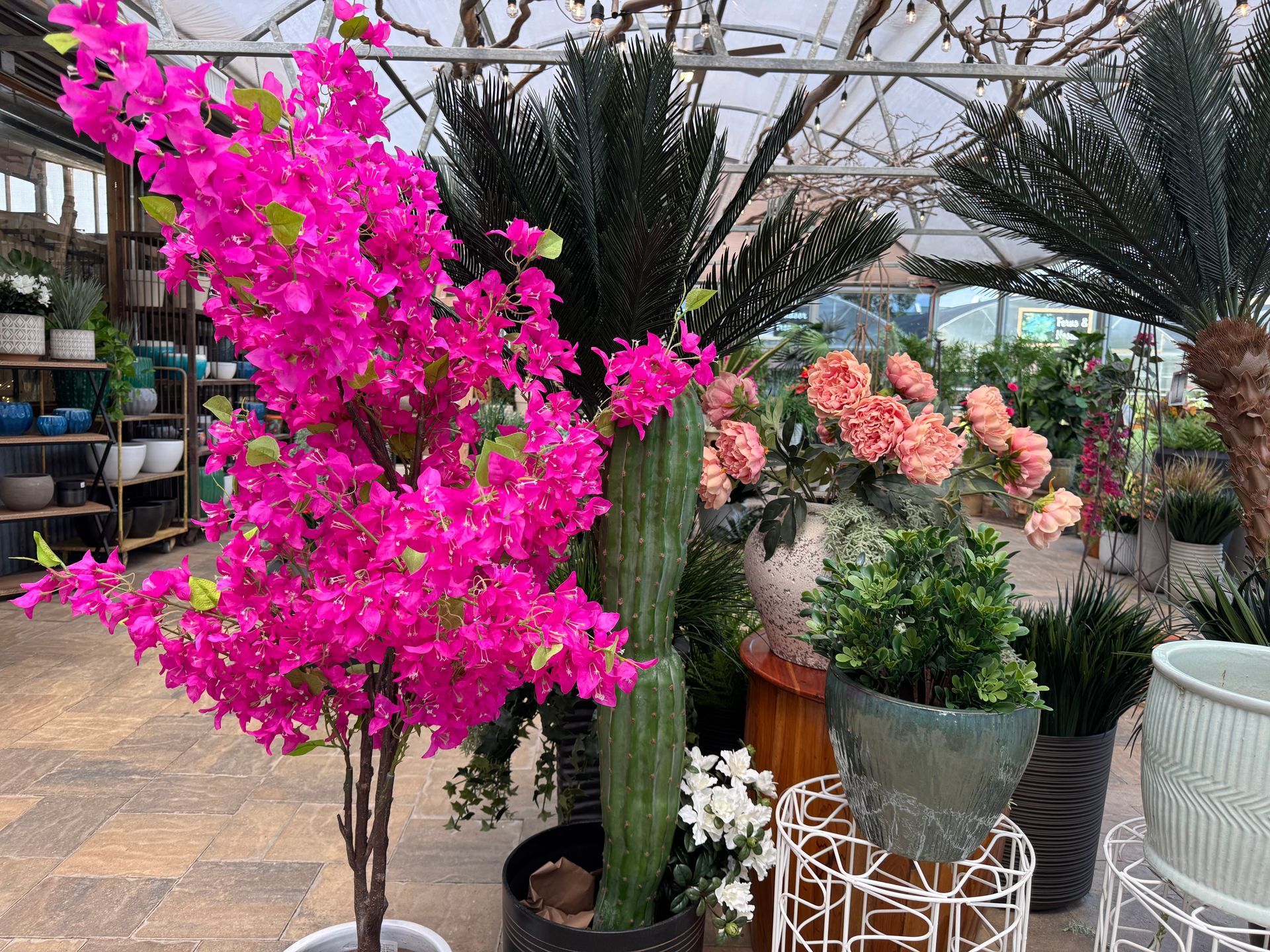 Artificial plants and pots. Located in the third indoor greenhouse.
