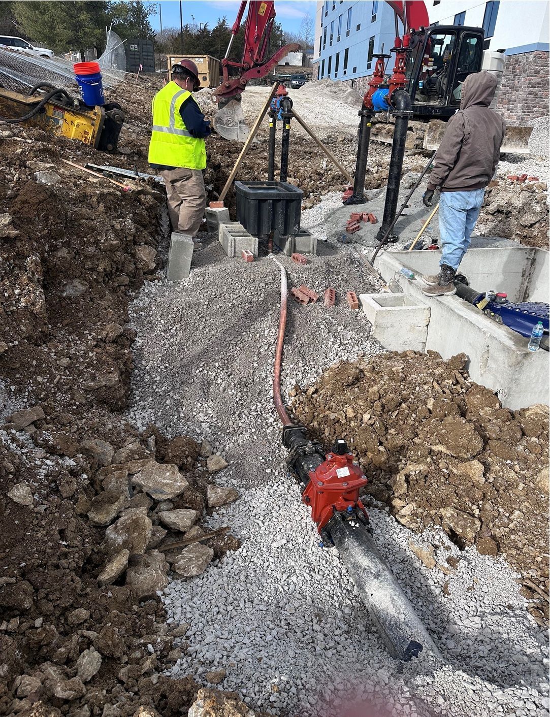 A group of construction workers are working on a construction site.