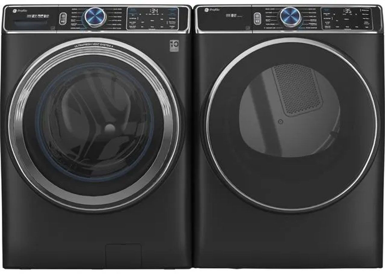 A washer and dryer are sitting next to each other on a white background.