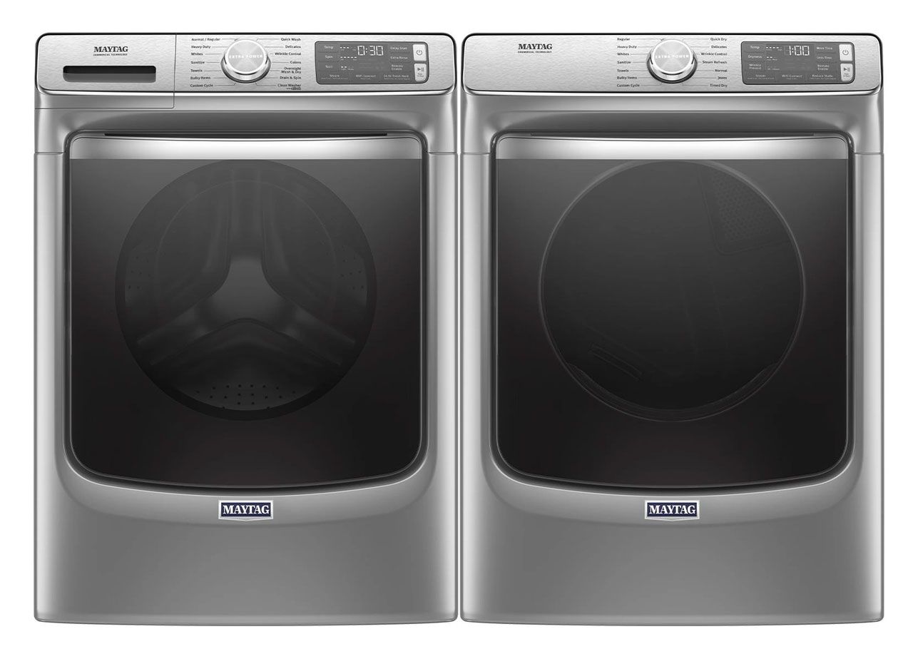 A washer and dryer are sitting next to each other on a white background.