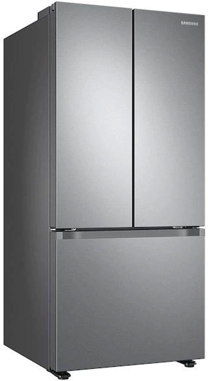 A stainless steel refrigerator freezer is sitting on a white surface.