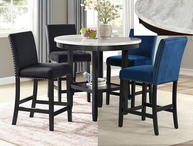 A dining room set with a table and four chairs